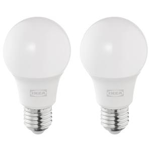 Two round white ikea led light bulbs with cool-white light, standing side by side.