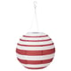 Red and white striped spherical solar-powered lantern hangs from a hook.