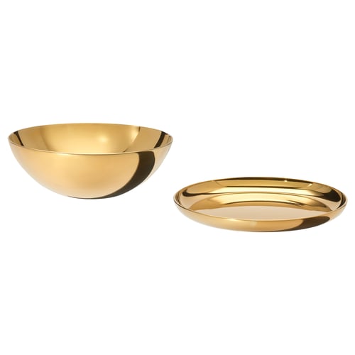 Gold bowl, shallow dish. Both polished stainless steel.
