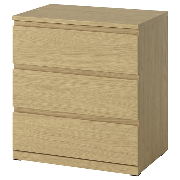 A STORKLINTA wooden chest in oak colour with three drawers, featuring a sleek and modern design.