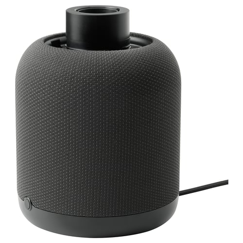 A black SYMFONISK wifi speaker lamp with a cylindrical shape and fabric cover. It doubles as a speaker and lamp.