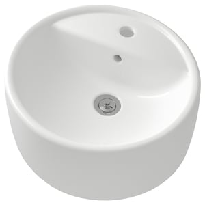 A white, round TÖRNVIKEN ceramic basin, sleek and modern with a chrome drain.