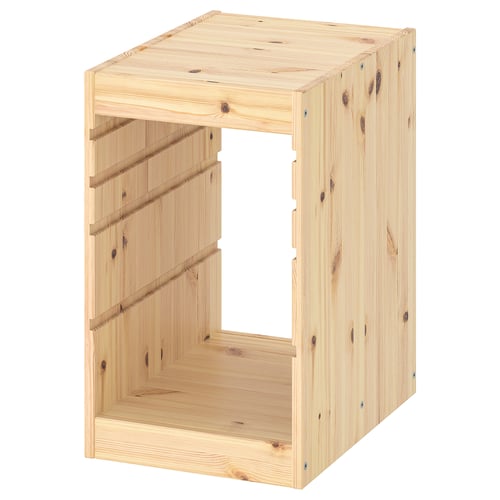 A light-wooden, light-colored, TROFAST pine storage box frame with clean, simple design, featuring guide rails for customizable storage.