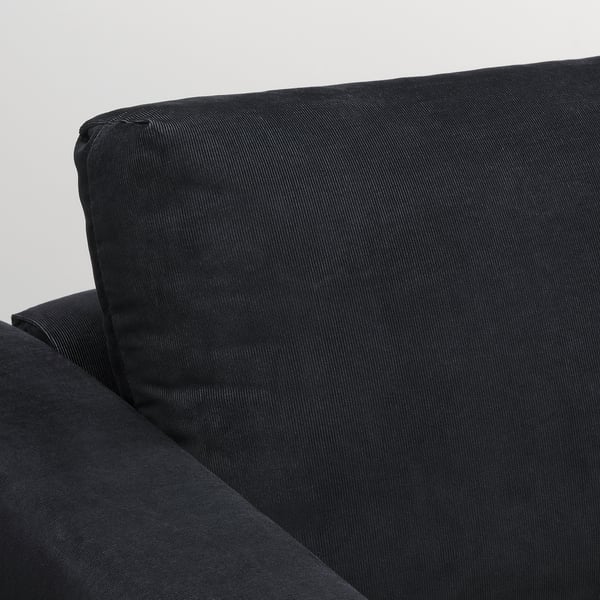 Black modern sofa, well-cushioned, clean lines, durable fabric, cosy and stylish.