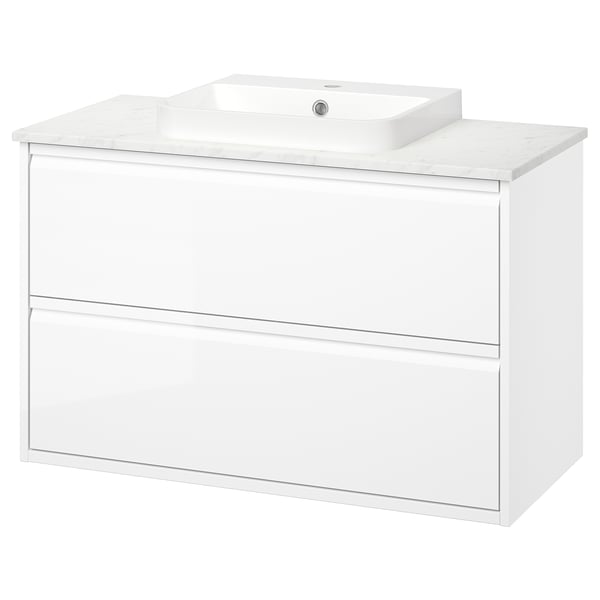 A white ÄNGSJÖN wall-mounted bathroom vanity with a marble countertop and a semi-recessed sink. It sleek, minimal design and two full drawers.