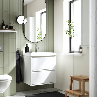 Modern white bathroom combo: sleek vanity, smooth sink, wall-mounted.