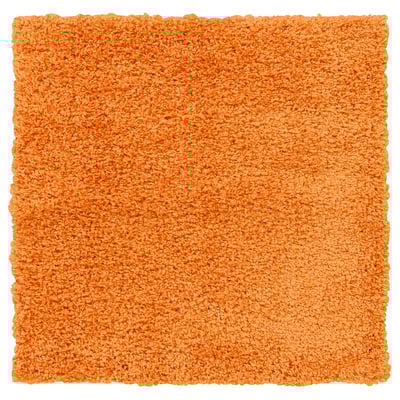 Orange, square, shaggy area rug. Soft, dense fibres for comfort.