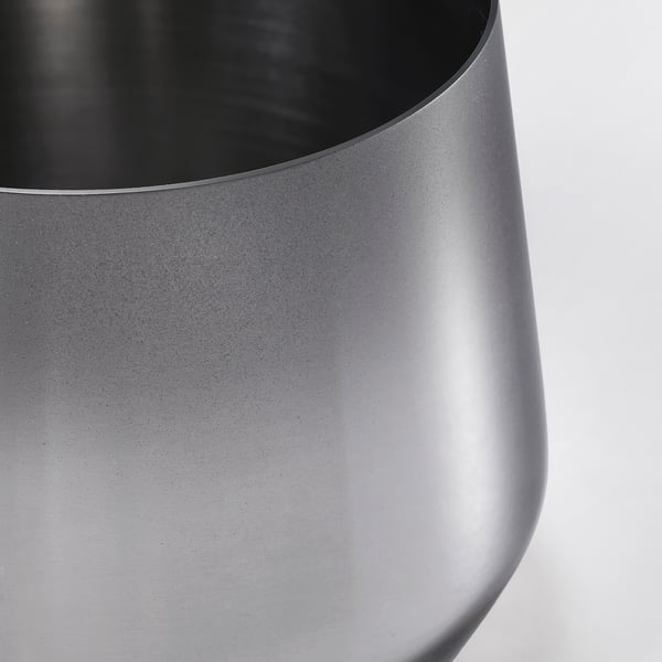 Sleek stainless-steel jar with smooth surface and tight-fitting lid.
