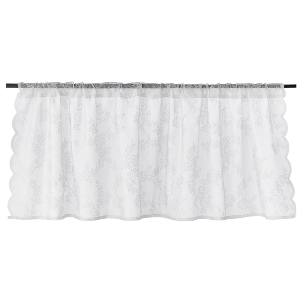The ALVINE SPETS white curtain. Its made of recycled polyester, sheer, and hangs with a rod pocket.