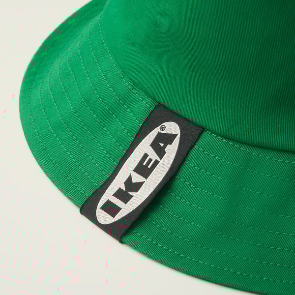 Bright green bucket hat with black ikea patch, well-stitched, high quality.