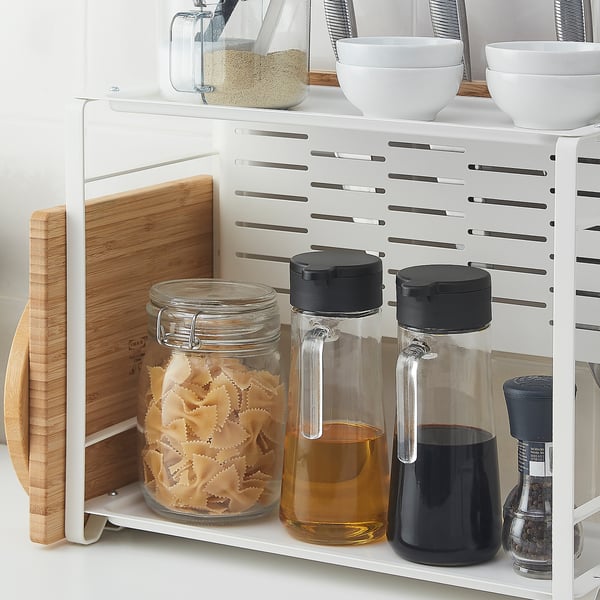 Kitchen counter organiser with two shelves holding jars, bottles, and knives, plus hooks and knife holder.