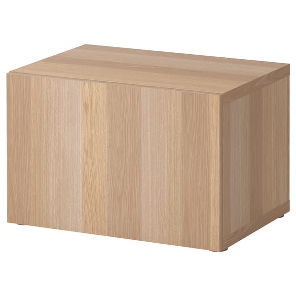 Ikea BESTÅ wooden storage unit, light oak, rectangular, minimalist design.