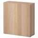 Light wood BESTÅ unit, simple, boxy shape, honey-colored.