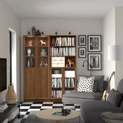 Contemporary living room with BILLY bookcases, grey sofa, black & white floor. Guitars, books & decor.