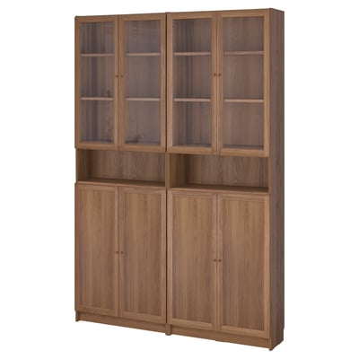 Wooden BILLY bookshelf; light brown, rectangular, with glass top doors and solid wood base doors.