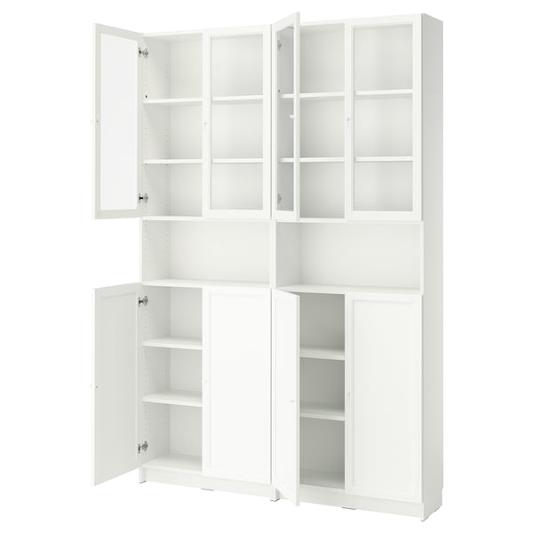 A tall white BILLY bookcase with glass doors and adjustable shelves. It three sections, two with glass doors and one solid.