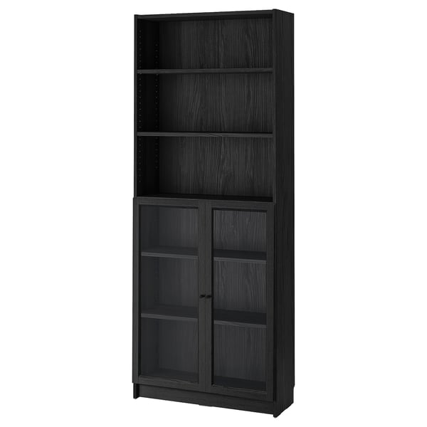 Black BILLY bookcase with glass doors, modern design, particleboard and tempered glass material, rectangular shape.
