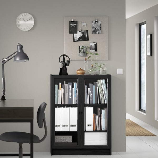 Modern home office with BILLY bookcase, desk, chair, and wall decor.