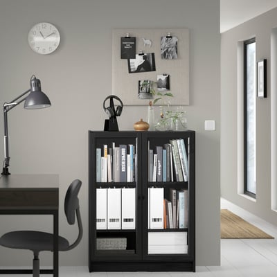 Modern home office with BILLY bookcase, desk, chair, and wall decor.