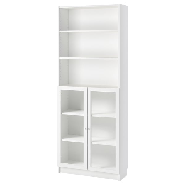 White BILLY bookcase with adjustable shelves and glass doors.