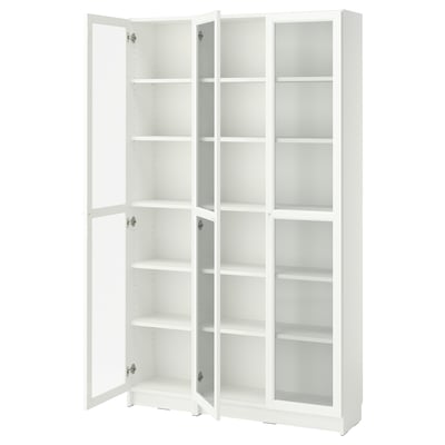 A white BILLY bookcase with glass doors. It adjustable shelves and a sleek design.