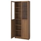 BILLY: wooden bookcase, adjustable shelves, glass-paneled doors, warm brown colour.