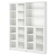 A white BILLY bookcase with multiple shelves and glass doors.