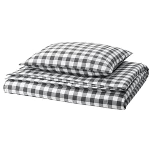 Folded black & white chequered gingham bedding set, featuring duvet and pillowcases, crafted from 100% organic cotton.