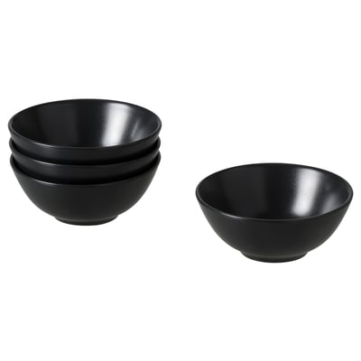 Four black FÄRGKLAR bowls. Two stacked, two separate. Simple, round design with matte finish. Ideal for various meals.