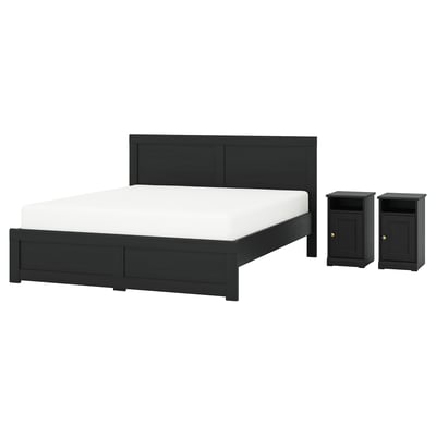 Modern black oak bedroom set with bed and two bedside tables, sleek design with decorative panels.