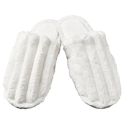 Two white fuzzy slippers, open-toe, plush design.