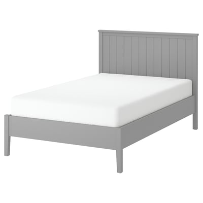 A grey GULLABERG bed frame with a white mattress. Vertical grooves on the high headboard. Robust grey legs and wooden slats for support.