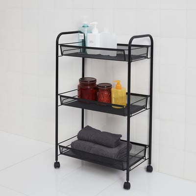 Black HORNAVAN trolley holds items neat. Three mesh shelves with castors. Stores bottles, jars, and towels. Fits small spaces, easily movable.