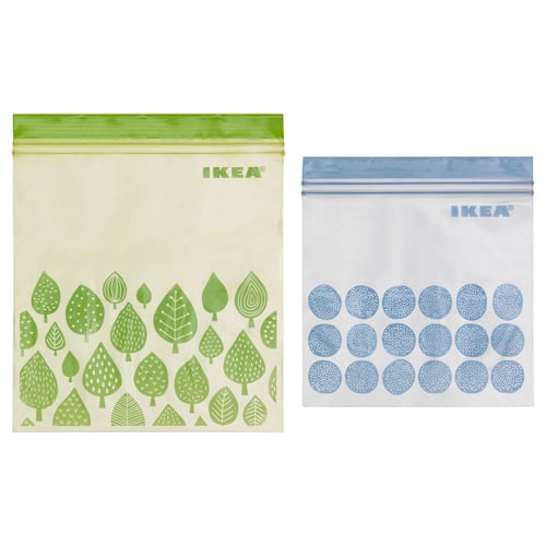 Two colourful zip bags, one green with leaf design, one blue with polka dots, IKEA brand.