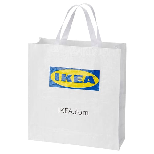 An IKEA shopping bag, white in colour, made of 100% polypropylene, with a rectangular shape and handles. It the IKEA logo prominently at the centre.