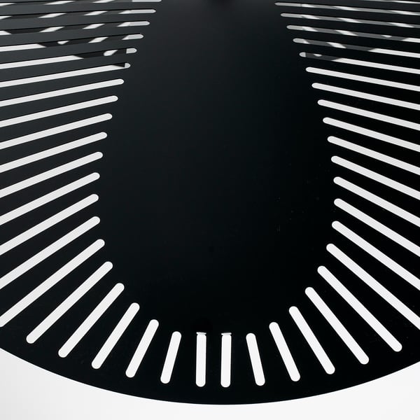 Modern black lamp shade with precise, evenly spaced white slots; creates warm, ambient light.