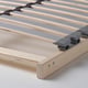 Close-up of sturdy wooden bed base with grey slats and clips, showing quality craftsmanship.
