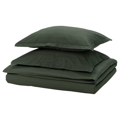 A dark green cotton duvet set with waffle texture. Includes one duvet cover and two pillowcases, neatly folded.