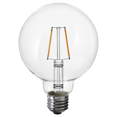 IKEAs LUNNOM bulb is clear, spherical, and energy efficient, with a retro filament design. Its made of glass and emits warm white light.