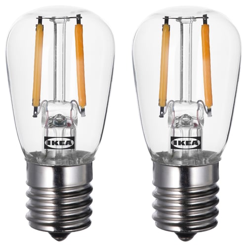 Two LUNNOM led bulbs by IKEA. Clear glass, warm white light, retro style.