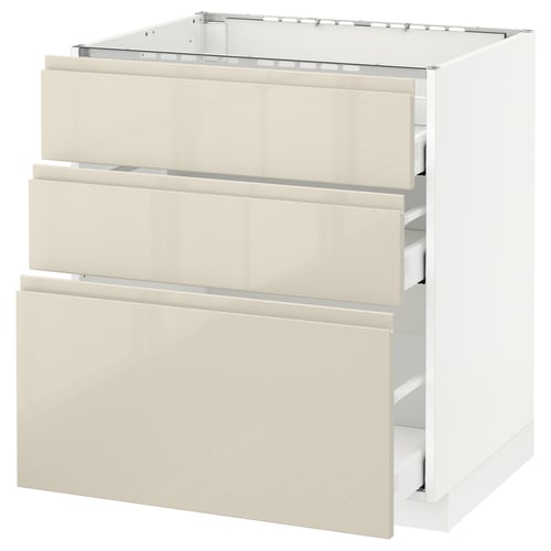 A white and beige ikea METOD kitchen cabinet with three drawers and a smooth glossy finish.