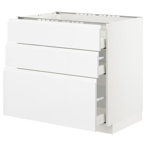 White kitchen cabinet with three drawers, sleek high gloss finish, modern design.