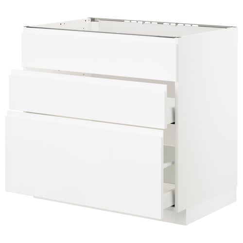 White cabinet from IKEAs METOD kitchen system, featuring sleek high-gloss drawers and doors with integrated handles. Modern and minimalist design.