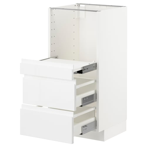 White METOD kitchen unit with drawers and pull-out shelf.