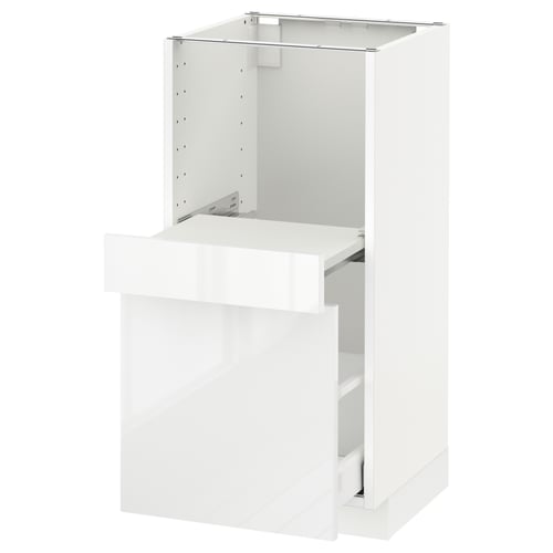 A white glossy METOD kitchen cabinet unit. It a drawer and open storage space, designed for modern kitchens.