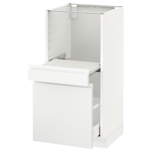 White modern kitchen cabinet with one open drawer.