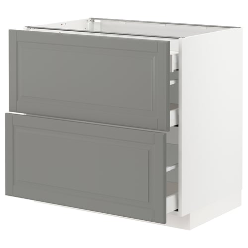 A soft grey METOD kitchen cabinet with two drawers and a door, featuring a traditional design with bevelled edges.