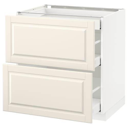 A white METOD kitchen cabinet with two open drawers.