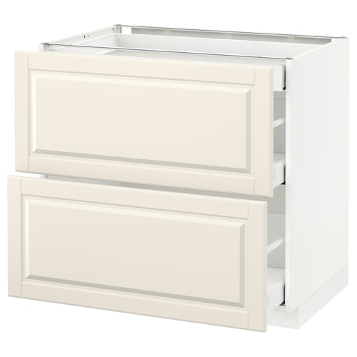 This image shows a white METOD kitchen base cabinet with off-white bodbyn drawer fronts. It has two drawers with a traditional design.
