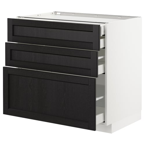 Black stained wooden drawers, white cabinet base, three drawers open, crafted by IKEAs METOD kitchen system.